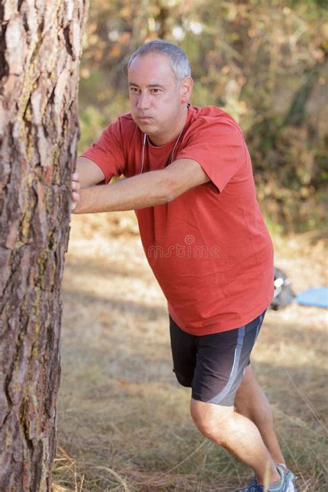 Man Leaning Against Tree Stock Photo Image Of Long Profile 21963670