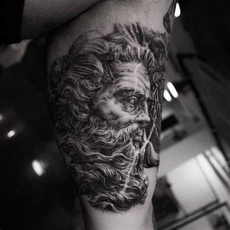 Black And Grey Style Bust Of Neptune Tattoo Located