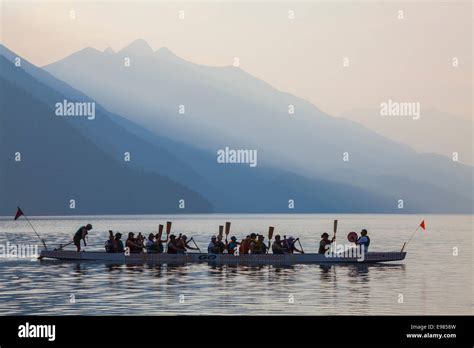 Woman Rowing Dragon Boat On Slocan Lake New Denver Slocan Valley