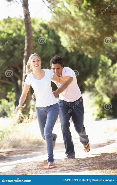 Young Couple On Romantic Walk In Countryside Stock Image Image Of