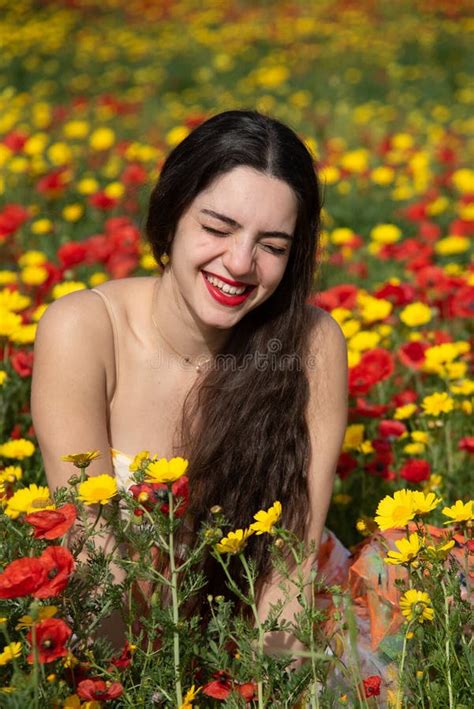 Portrait Of A Young Woman With Closed Eyes In The Field In Spring