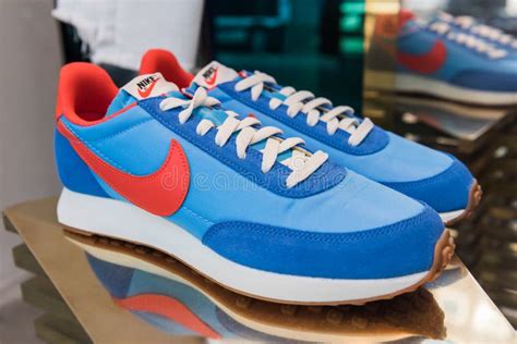 Blue Color Nike Shoes in Store Showcase. Editorial Photo - Image of ...