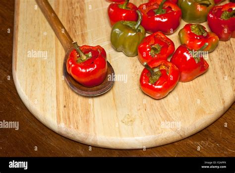 Red Hot Chili Peppers On Cutting Board Stock Photo Alamy