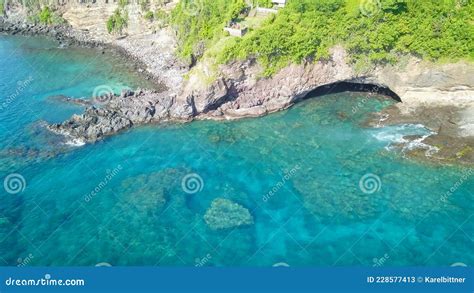 Aerial Top View Of Tropical Island Surrounded By Turquoise Sea A Small