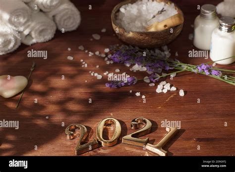 Spa Set With White Salt And Black Stones For Hot Massage Next To The Numbers Stock Photo