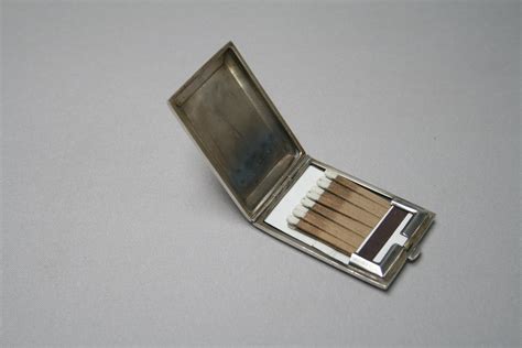 A Slimline Silver Matchbox Case With A Waved Line Design