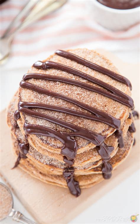 Churro Pancakes With Spicy Chocolate Sauce Cooking On The Front Burner