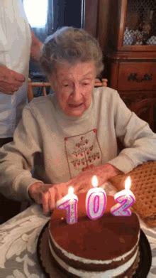 Old Woman Blowing Birthday Candles With Dentures GIFDB