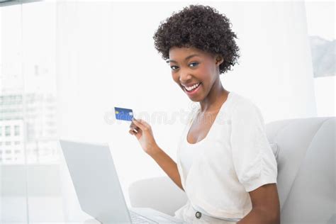 Smiling Gorgeous Brunette Using Her Credit Card To Buy Online Stock
