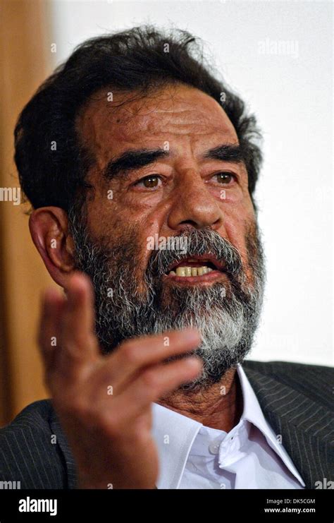 Former President Of Iraq Saddam Hussein Gestures During His Initial