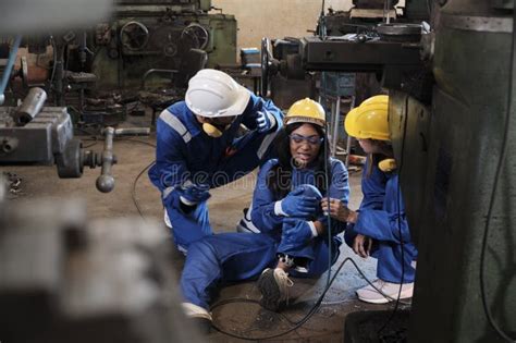 A Black Female Worker Has An Accident With A Leg Injury At A Factory