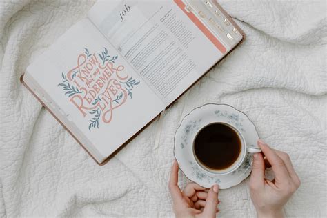 A Person Having Coffee While Reading a Book · Free Stock Photo