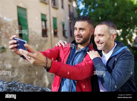 Gay Couple Making A Selfie With Their Smartphone Stock Photo Alamy