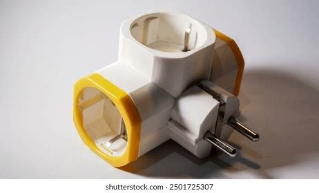 triple electric plug socket adapter isolated  white background