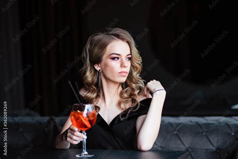 Beautiful Blonde Young Girl Holding An Aperol Spritz Aperol Cocktail