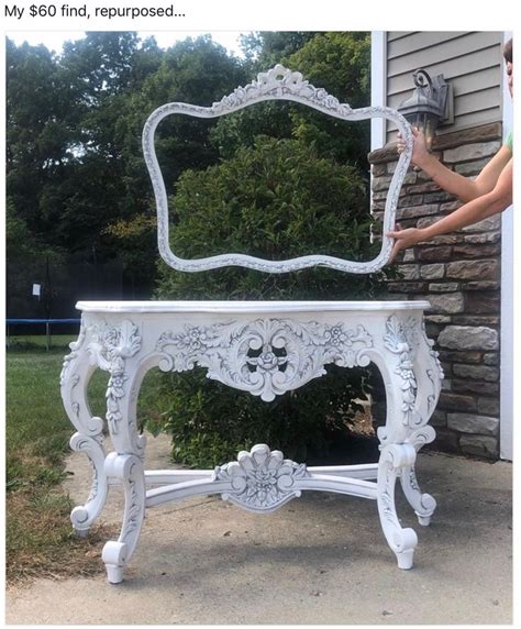 A White Vanity With An Ornate Mirror On It S Top And Legs Sitting In