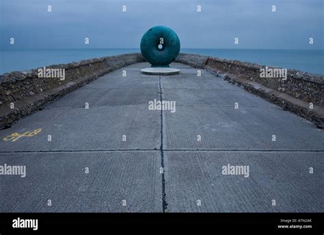 Coastal erosion prevention structure called a groyne with a donut shape ...