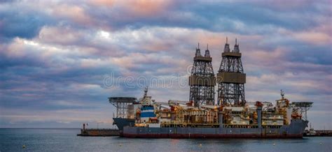 Offshore oil rig at sunset stock image. Image of offshore - 120361951