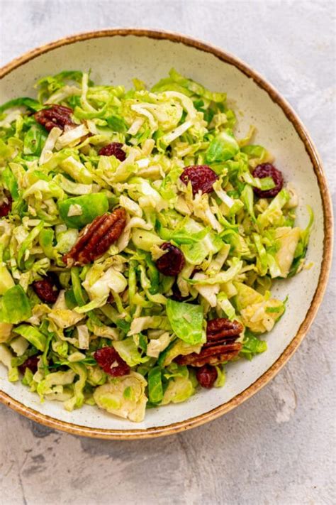 Brussels Sprout Slaw With Pecans And Cranberries Lexi S Clean Kitchen