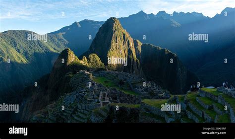 Machu Picchu Panorama At Sunrise With First Sun Rays Illuminating The