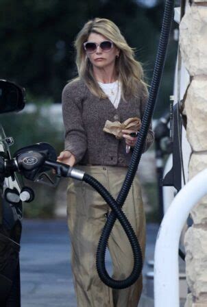 Lori Loughlin – Pumps gas in Los Angeles | GotCeleb