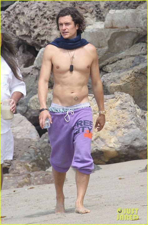 Orlando Bloom Goes Shirtless Wears A Scarf At The Beach Photo