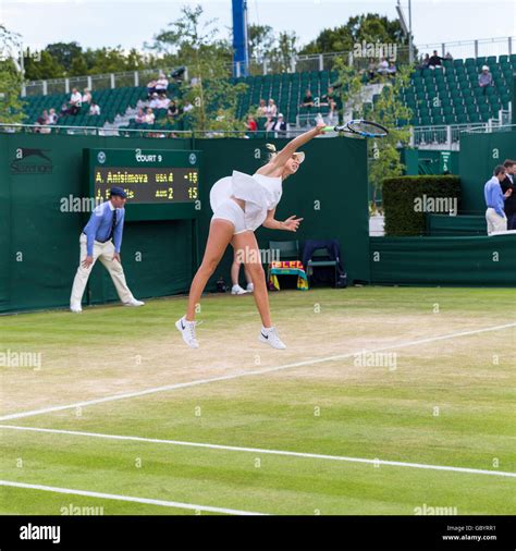 Amanda Anisimova, American tennis player, serves at the Wimbledon Stock ...