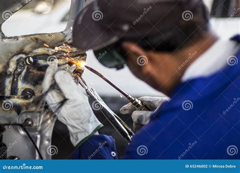 Man Mechanical Worker Repairing A Car Body In A Garage Safety At Work