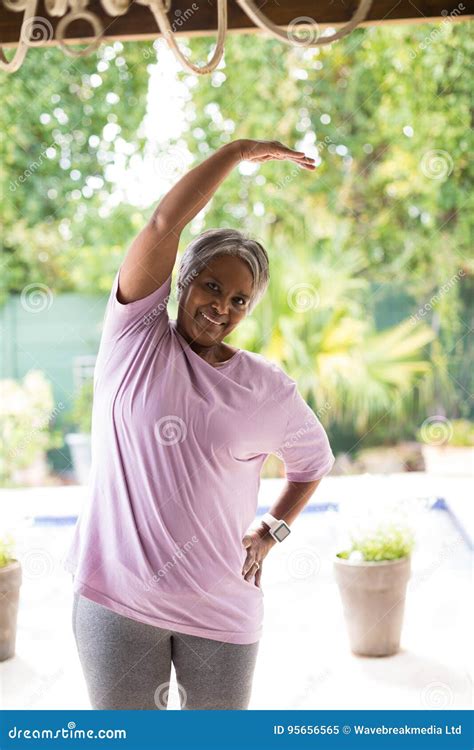 Portrait Of Smiling Senior Woman Exercising Stock Image Image Of Head