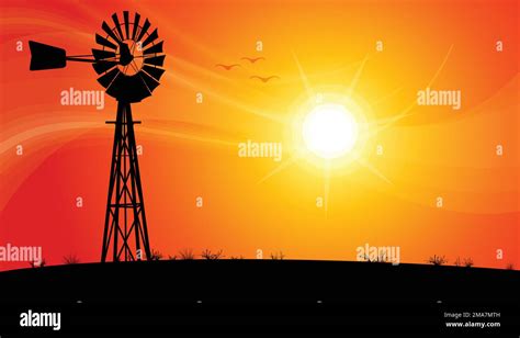 Australian Water Pump Windpump Metal Windmill Silhouette Against Orange