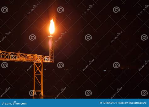 Offshore Oil Rig Flare Stack With Gas Flame Stock Photography