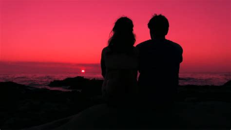 HD: Romantic Couple Sitting, Hug And Kiss At Sunset, Boy And Girl As A ...