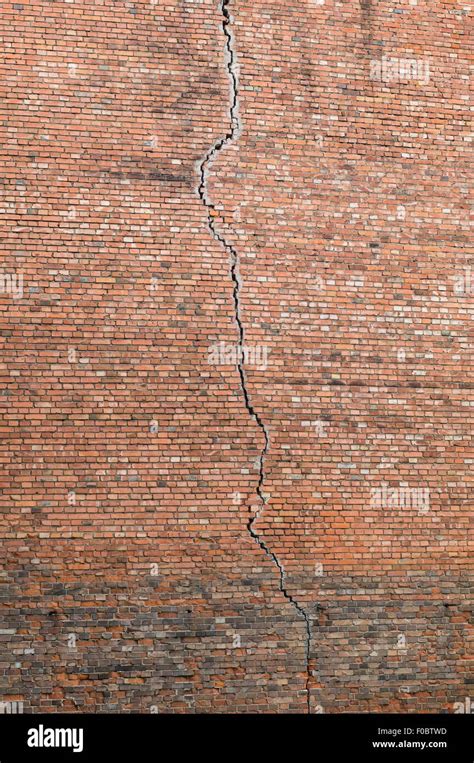 Long Vertical Crack In A Red Brick Wall Stock Photo Alamy