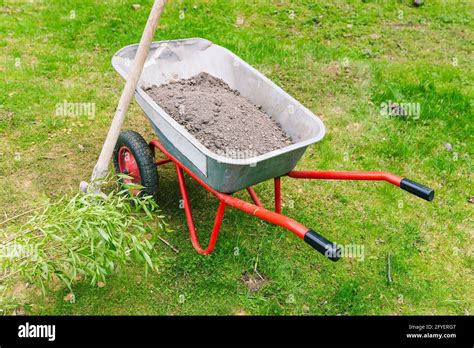 Garden Trolley With Soil On The Lawn Metal Construction Trolley For