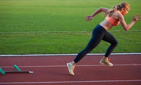 Woman Sprinter Leaving Starting Blocks 12655738 Stock Photo At Vecteezy