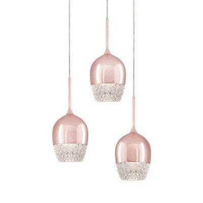 Three Pink Glass Hanging Lights With One Light On Each Side And The