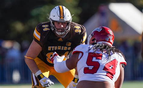 University of Wyoming Football Team Kicks Off Season in Illinois