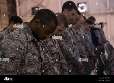 Us Air Force Airmen From The 820th Base Defense Group Bow Their Heads