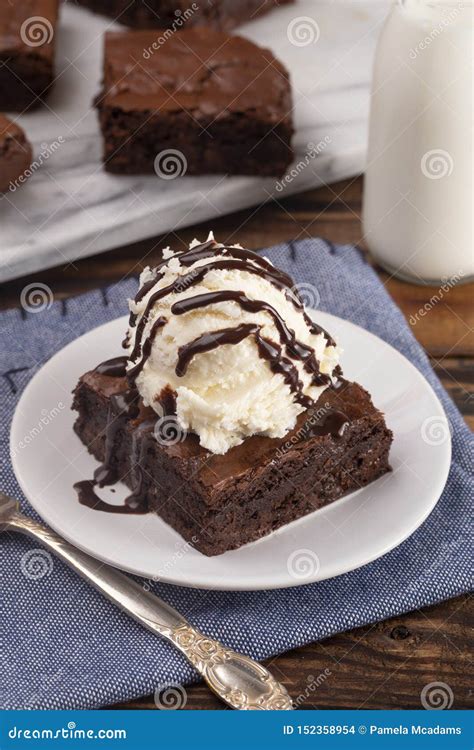 Double Chocolate Brownies Sundae With Vanilla Ice Cream On Top Stock