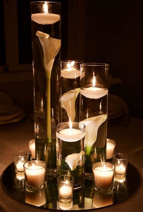 Submerged Calla Lily S In Cylinder Vases With Floating Candles