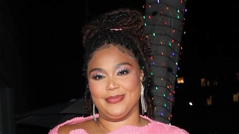 Lizzo Puts On A Stylish Display In Bright Pink Sweater Dress As She Steps Out For Dinner With