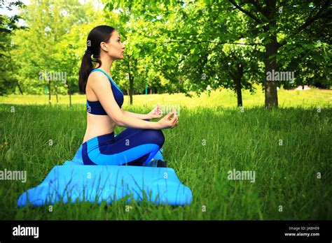 Fitness Scene Girl In Lotos Pose In Park Pretty Girl Doing Yoga