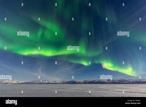 Northern Lights Aurora Borealis Over Snowy Mountains Abisko National