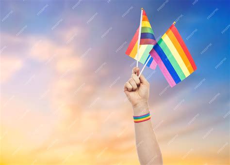 Premium Photo Hand With Gay Pride Rainbow Flags And Wristband