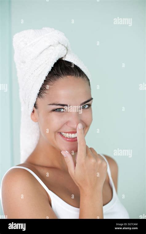 Brunette Woman Applying Anti Wrinkle Cream After The Shower Stock Photo Alamy