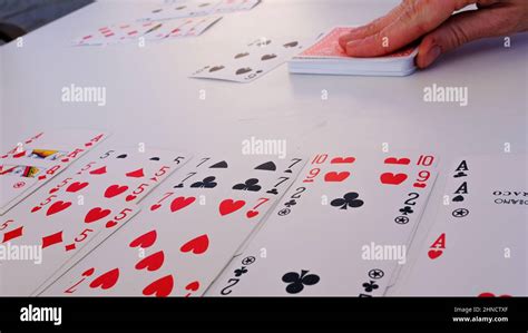 French cards on white table in game burraco Stock Photo - Alamy