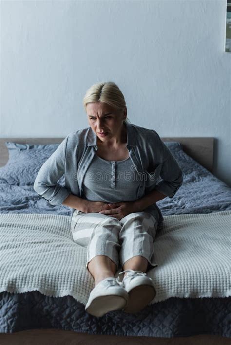 Upset Blonde Woman With Menopause Suffering Stock Photo Image Of