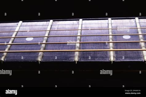 Details Of An Acoustic Guitar Neck And Fretboard Stock Photo Alamy