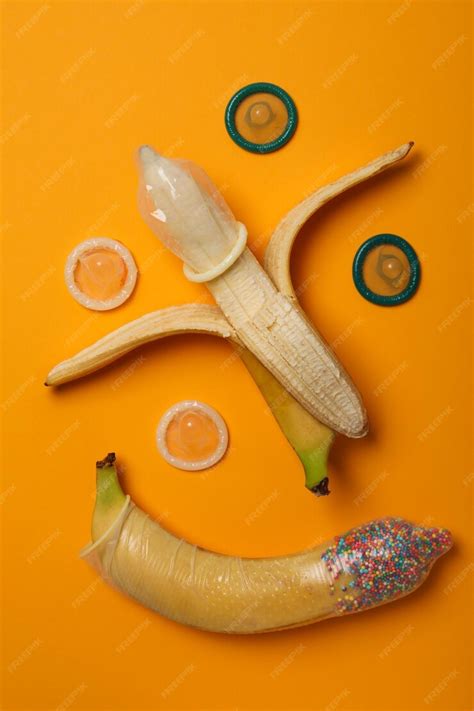 Premium Photo Condoms On Bananas On A Yellow Background