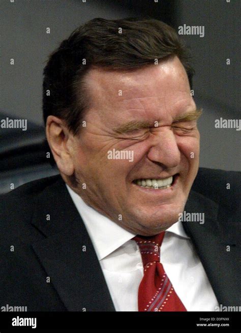 (dpa) - German Chancellor Gerhard Schroeder pulls a face while ...